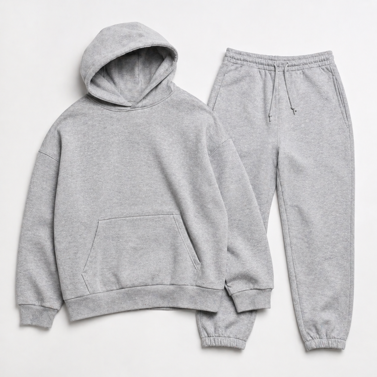 Full matching tracksuit set with hoodie and sweatpants laid flat on a white background